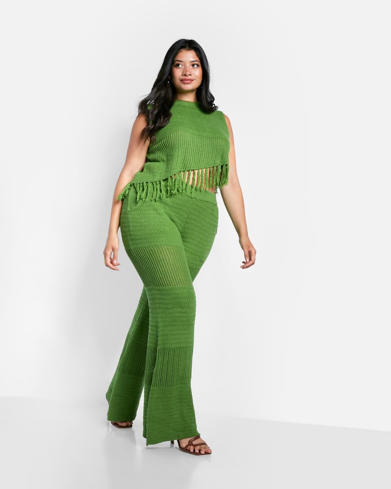 Front of a model wearing a size 1X Shanti Crochet Bell Bottom Pants W. Pockets - Apple Green in Green by Rebdolls. | dia_product_style_image_id:324356